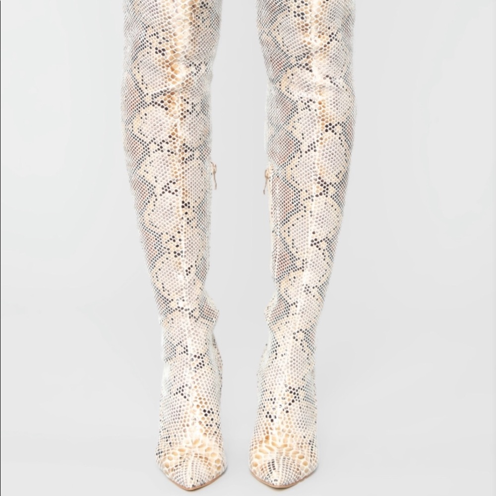 Thigh high snake skin boots